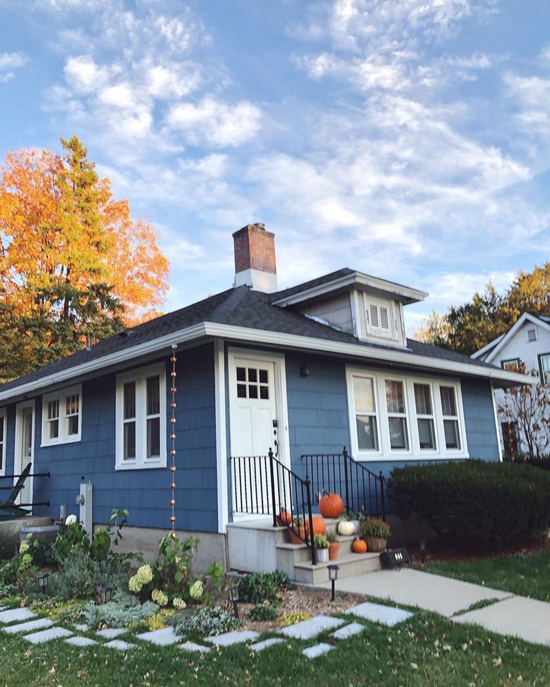 Home exterior painted with Smoky Blue (Swipe to see unlit reflection)