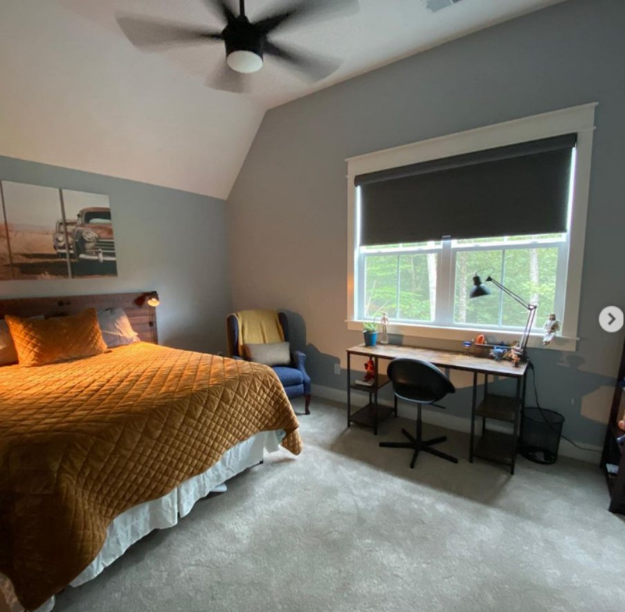 A Krypton Bedroom with Yellow Bedding