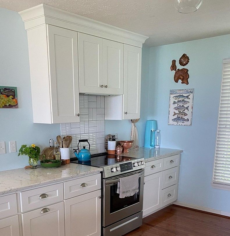 Sherwin Williams Blue Horizon used on interior walls in a kitchen and living room.01