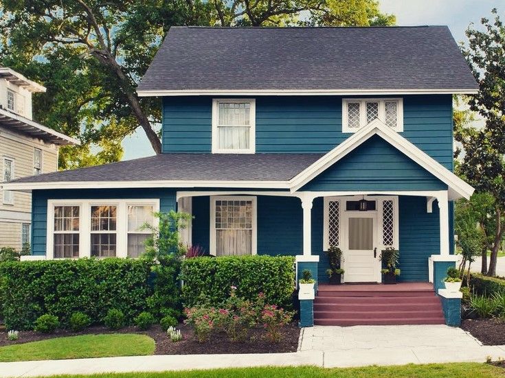 Sherwin Williams Deep Sea Dive on the exterior, an accent wall, and a door.01