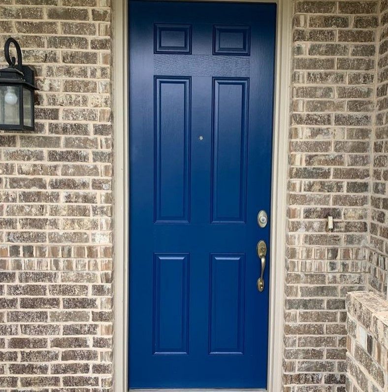 Sherwin Williams Loyal Blue on an accent wall and a front door.02