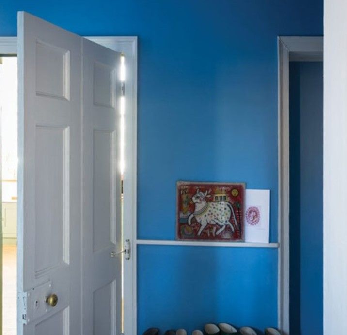 Farrow & Ball Cook’s Blue on interior walls and paired with greige in a bathroom.