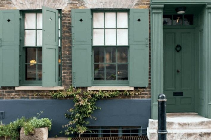 Farrow & Ball Green Smoke on window shutters and a front door.