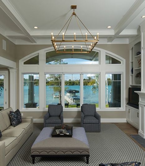 Sherwin Williams Amazing Gray works well with the white trims in this living room