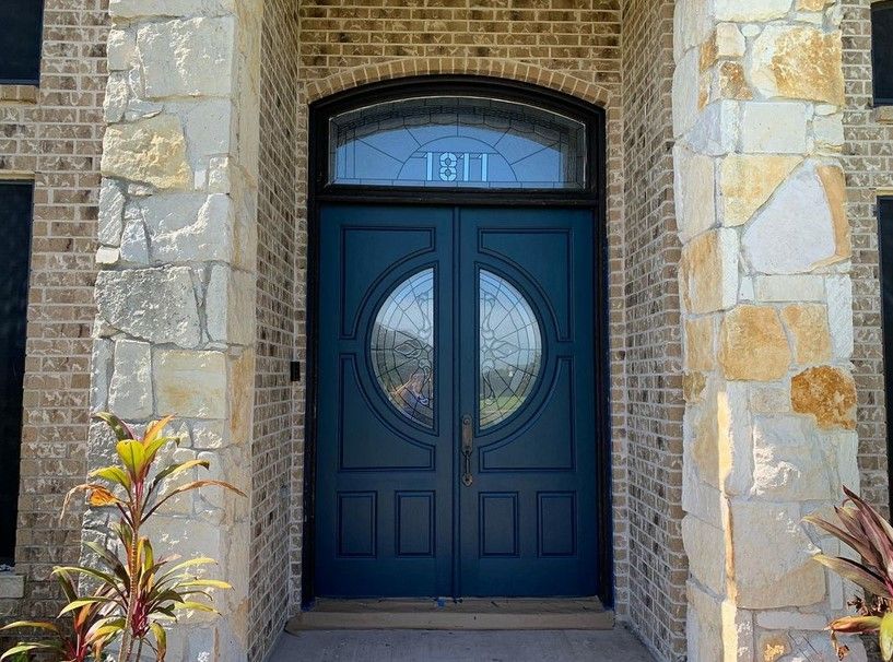 Sherwin Williams Moscow Midnight on a front door and exterior walls.